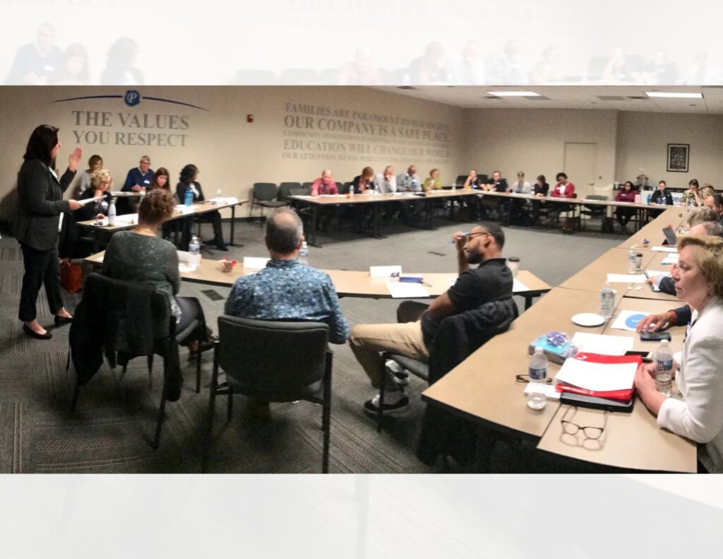Large conference room with about 30 people for a roundtable discussion hosted by Steadfast