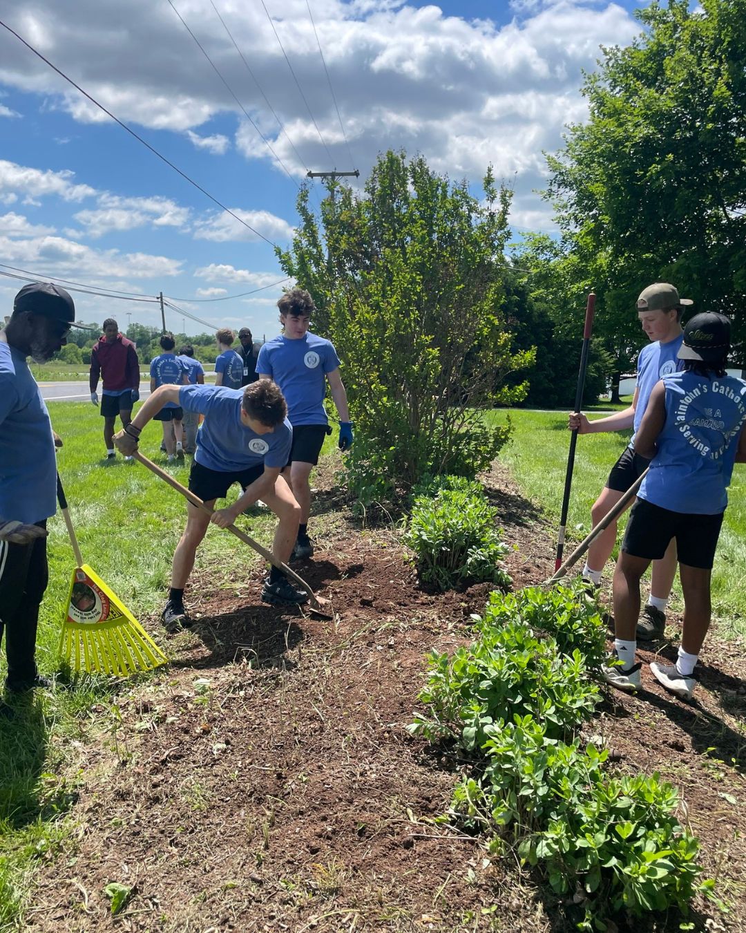 teens tending to the landscaping in the front yard of Steadfast
